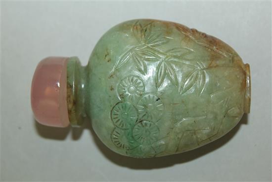 A Chinese pale green and russet jadeite snuff bottle, 1880-1930, 5.9cm